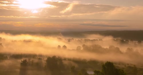 Timelapse of Sunrise Over Misty River