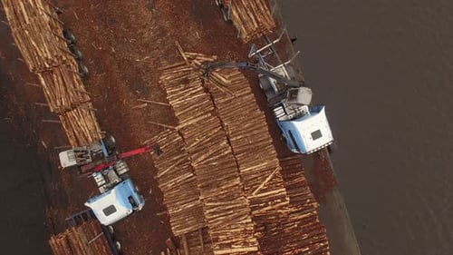 Forestry and logging operations taking place in the highlands of Scotland using large industrial mac