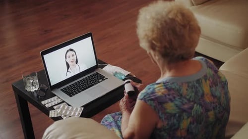 Senior Woman Consults with Doctor Online
