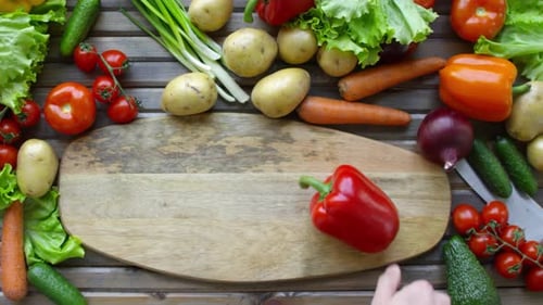 Vegetables Placed Around Wooden Cutting Board