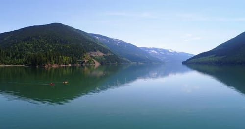 People kayaking in lake 4k
