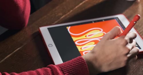 Close Up Female Designer Sitting and Working at Desk. Contemporary Young Woman Drawing and Using Pen