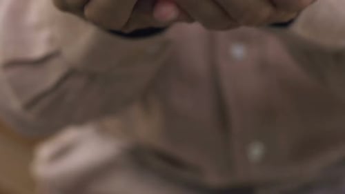 Pile of Gold Coins in Open Hands