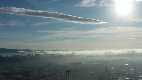 Fog morning at downtown district. Above the clouds.