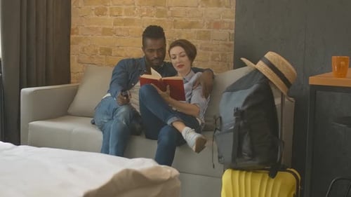 Relaxing Couple Reading Book in Modern Apartment