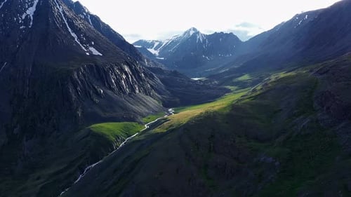 Aerial Drone View: Flight Over Pine Tree Forest and Mountain River in Sunset Soft Light. Mountain