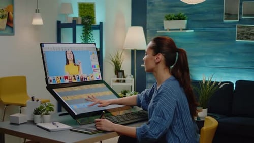 Photographer Working on Retouching Pictures at Studio