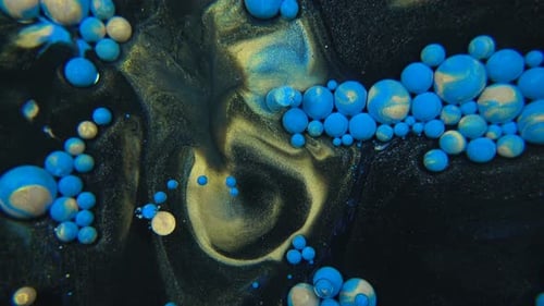 Blue and Gold Paint Mixing in Macro Close-Up