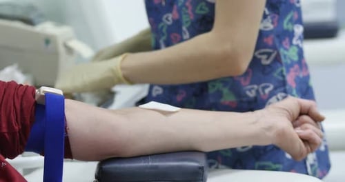 Healthcare Worker Drawing Blood From Patient's Arm