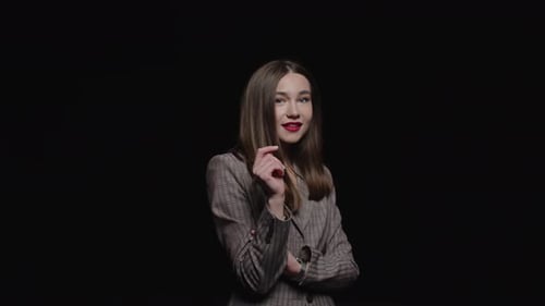 Elegant Woman Smiling and Posing in Studio