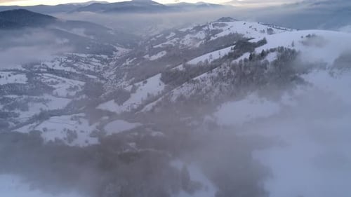 Aerial View in Foggy Sunset Winter Mountain