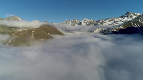 Aerial View of Mountains Above Cloud Inversion