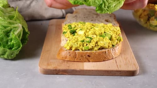 Woman Hands Making Vegan Sandwich Club