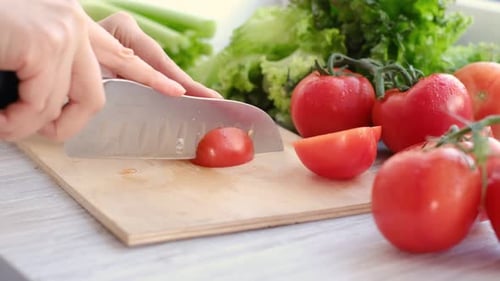 Slicing Fresh Tomatoes for a Colorful Salad