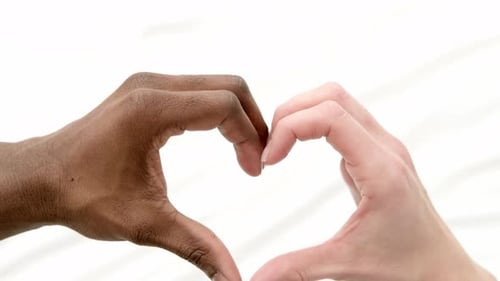 Heart From Hands Close Up Multiracial Couple African Man and Caucasian Woman Lovers Concept Mixed