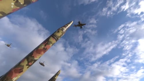 missile launchers military helicopters are flying against the sky