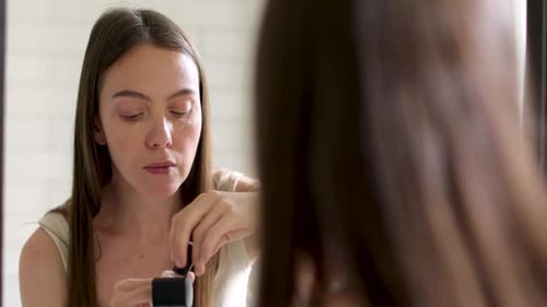 Woman Applying Foundation with Wand and Fingers