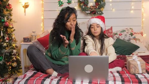 Woman and Girl Video Call at Christmas