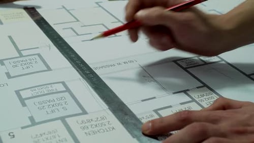 Engineers Planning the Building Construction – Architectural Drawing