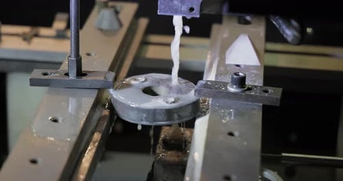Close Up Metal Part Being Cut on Machine