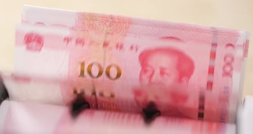 Close Up of Machine Counting Chinese Yuan