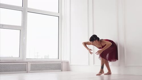 Elegant Woman Performing Contemporary Dance in Studio