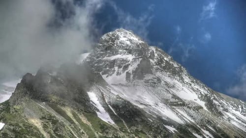 8K High Snowy Mountain Peak in Shape of a Symmetrical Pyramid