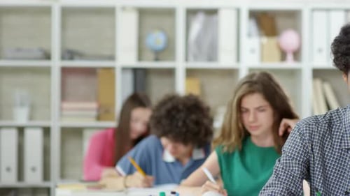 Attentive Teen Student Smiles in Class