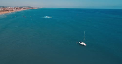 Drone Flies Around Sailing Yacht Stayed at Anchor on La Mata Beach in Torrevieja