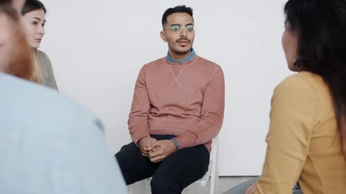 Man Speaking to Group Receives Applause