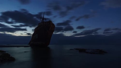 Sunrise Over Old Shipwreck on Ocean Beach