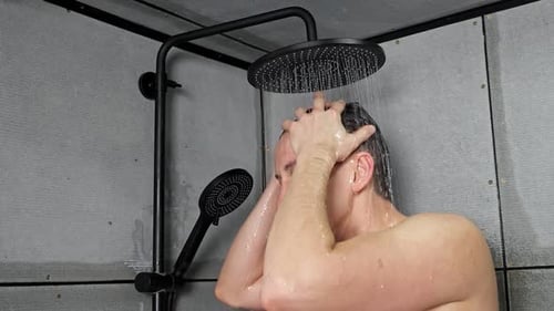 Man Washing Hair in Modern Shower