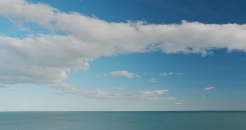 Sea View on the Nice Summer Day, Clean Blue Water and Smooth Waves, Blue Sky with Clouds, Horizon