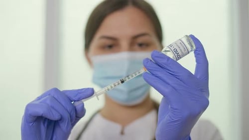 Medical Worker Preparing COVID-19 Vaccine in Hospital
