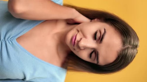 Young Woman Posing with Hand on Neck