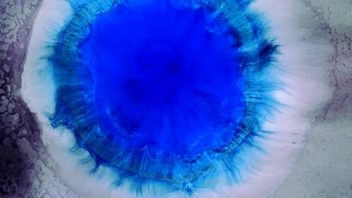 Abstract Blue Ink Bloom on Textured Surface
