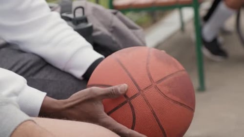Unrecognizable Man with Basketball Outside