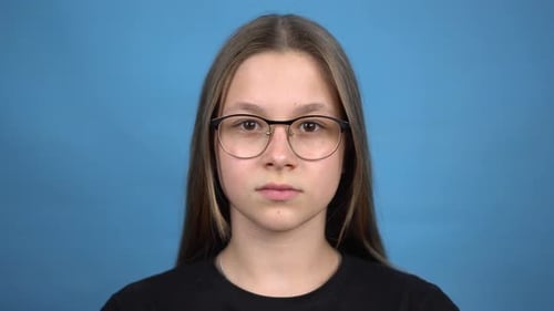 Teen Smiling with Glasses and Braces