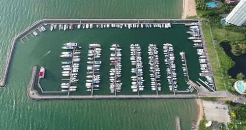 Aerial view of speed boats on the sea near beach city