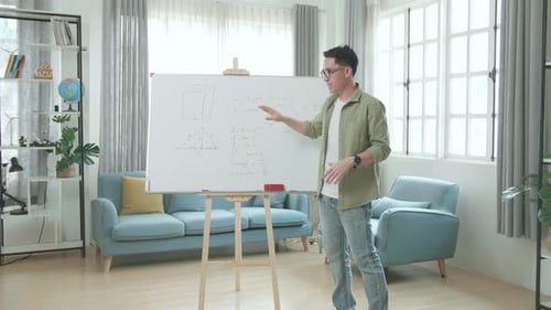 Young Adult Teacher Explains Equations on Whiteboard