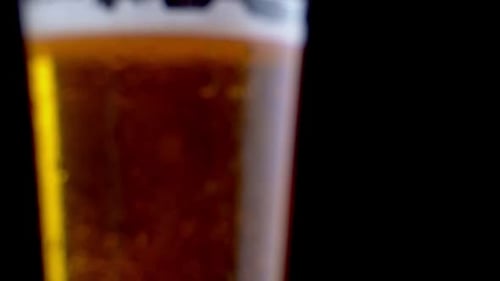 Refreshing Beer in Glass, Cold Drink with Bubbles