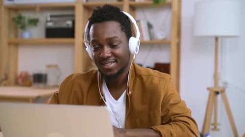 Young Man Using Laptop at Home, Video Call