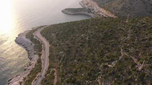 Aerial View From Drone of Green Mountains Road and the Sea