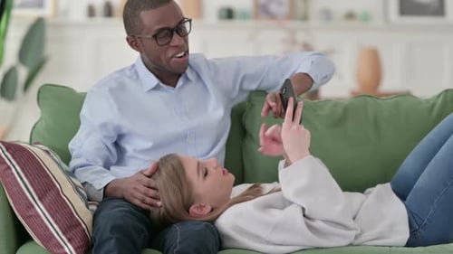 Couple Relaxing at Home Video Chatting