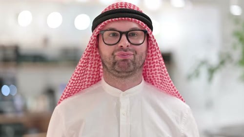Close Up of Smiling Man in Head Covering