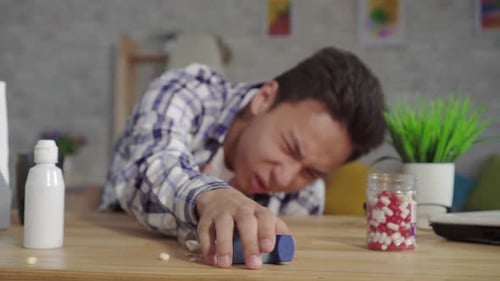 Sick Young Adult Reaches for Inhaler
