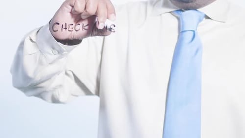 Asian Businessman Writes Check List