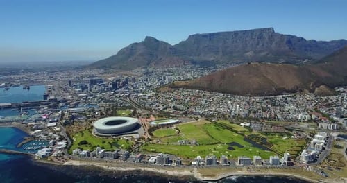 Aerial View of Coastal City and Mountain