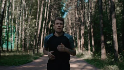 Young Handsome Man Train for Marathon Run in Park