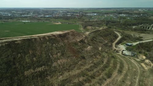 Aerial View of Landfill Site Near Urban Area
